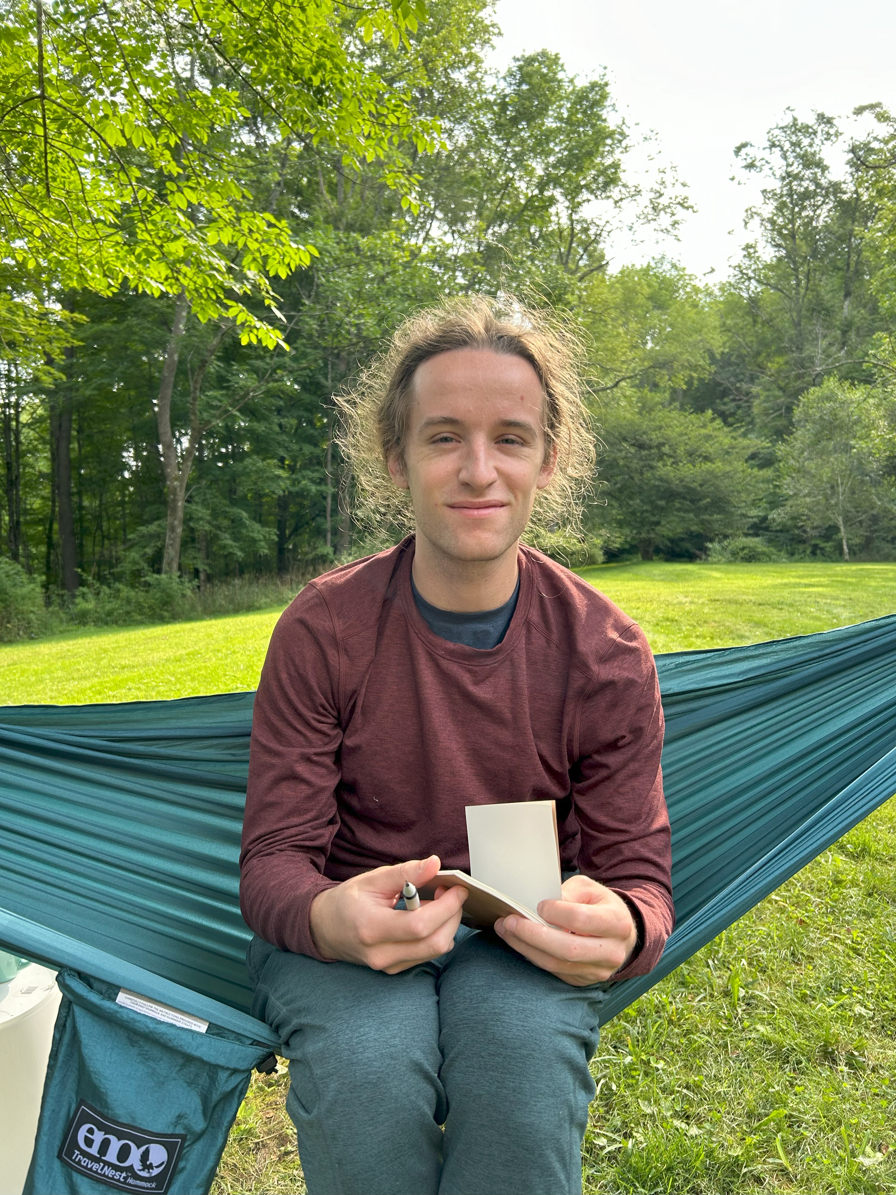 Sebastian sketching in a hammock